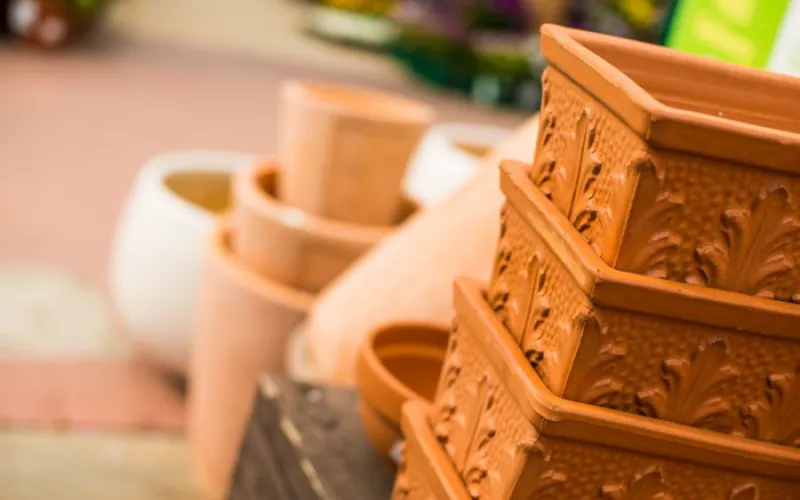 a group of orange garden planters