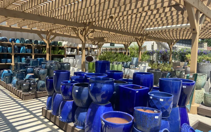 a group of blue vases