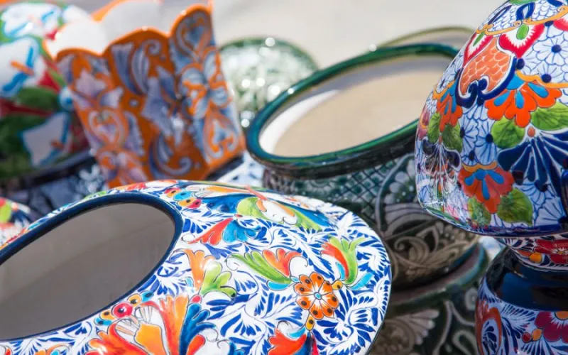 a colorful vase sitting on a table