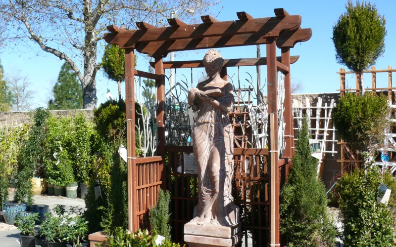 a statue of a person in a garden