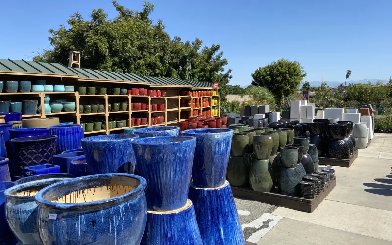 a group of blue vases