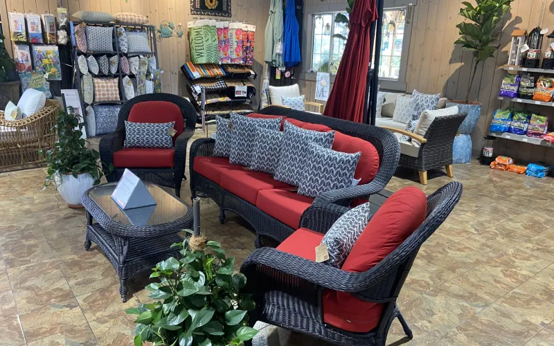 a room with a couch and chairs