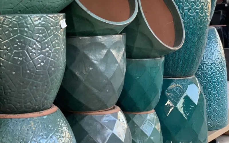 a group of green garden planters