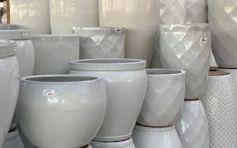 a group of white garden planters