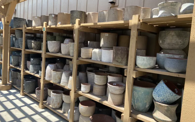 a room with many buckets and buckets on shelves