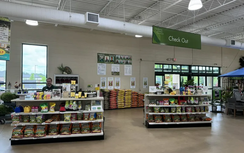 a store with a person behind a counter