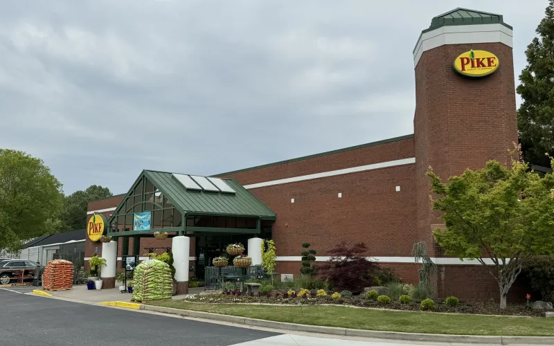 a brick building with a sign on it
