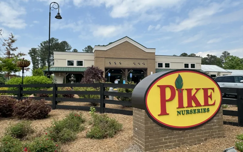 a sign in front of a building