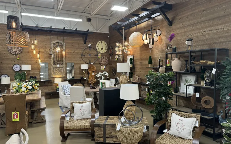 a room with a fireplace and chairs