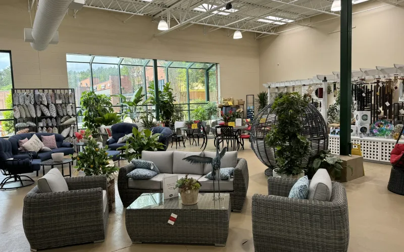 a large room with a large group of people sitting in chairs