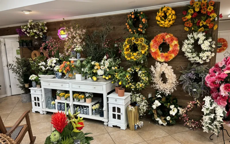 a flower shop with lots of flowers