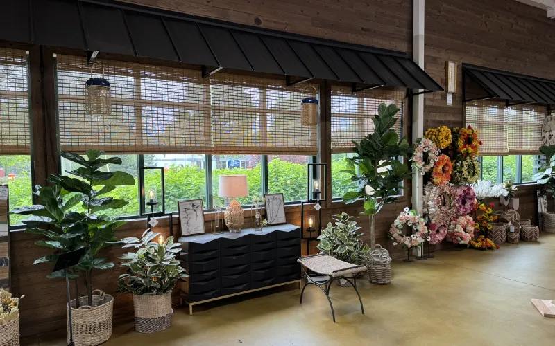 a room with a couch and flowers