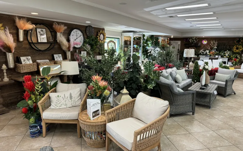 a living room with a large display of flowers