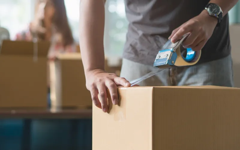 a person standing in front of a box