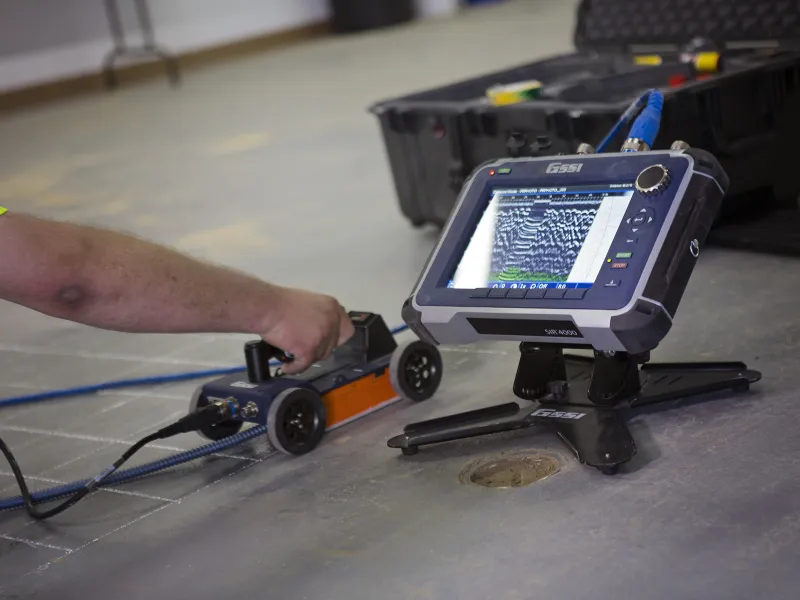 Close up of concrete scanning equipment to locate a broken sewer pipe or cross bore with underground utility services