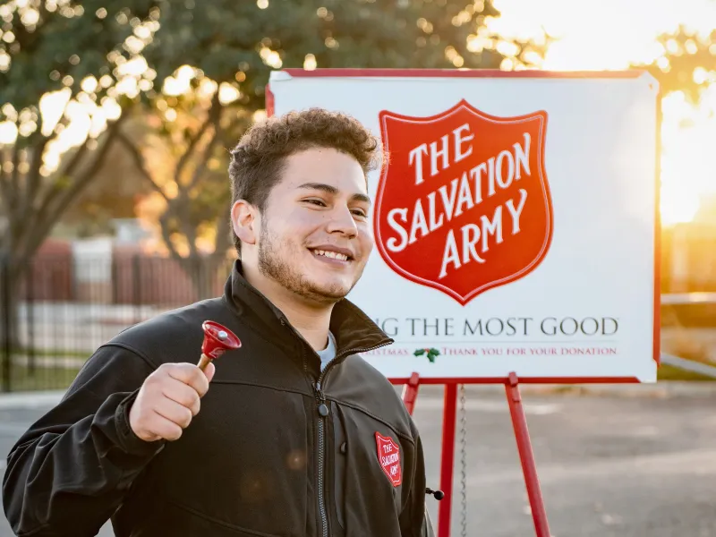 a man holding a red sign