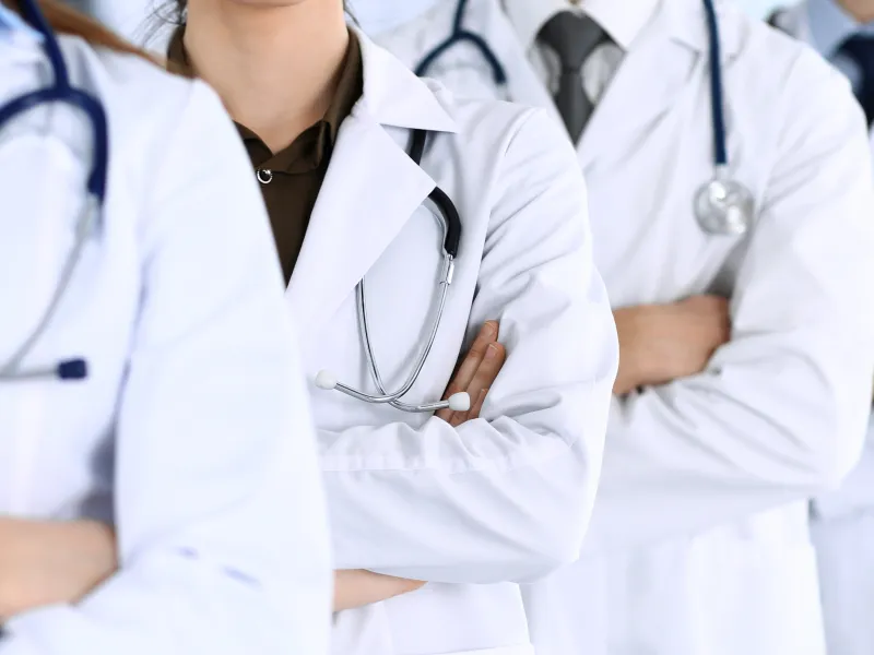 a group of doctors in white coats