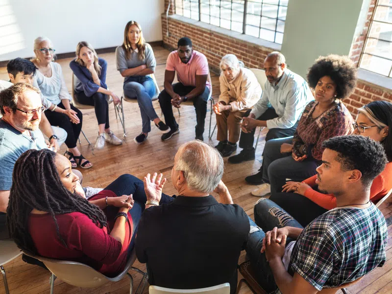 Small group in discussion during a dementia education session