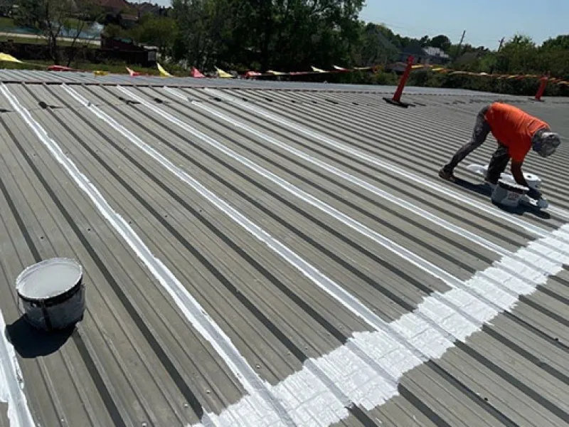 Mattco roofer repairing standing seam metal roof commercial property Texas