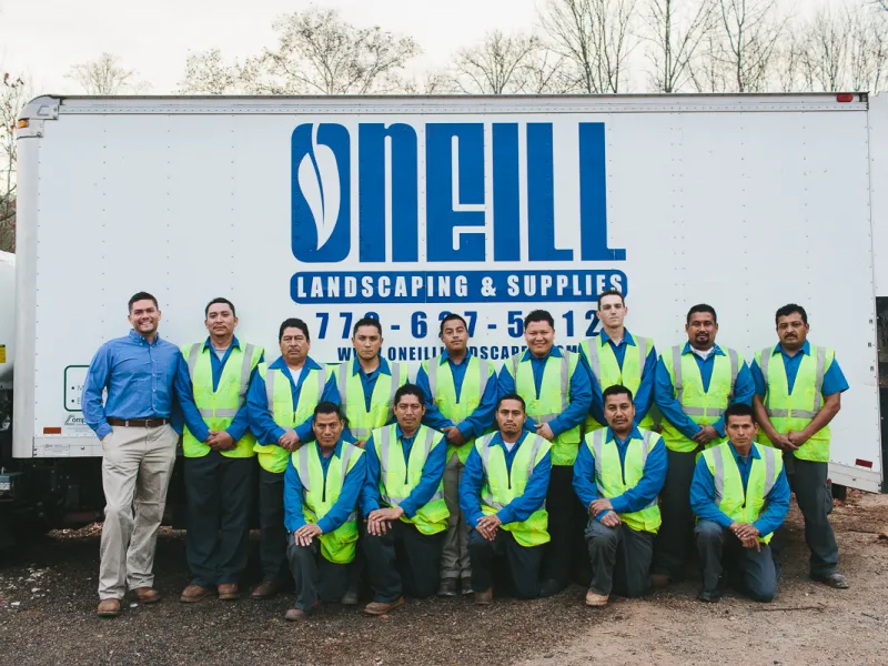 a group of people in front of a truck