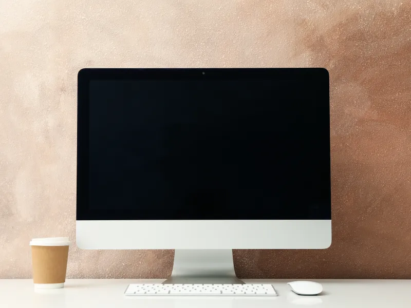 a white table with a white mug and glasses on it