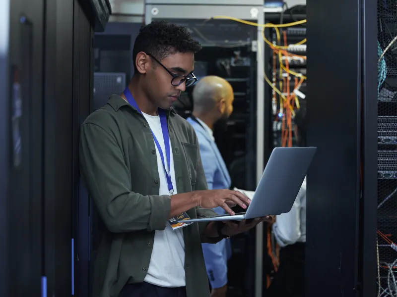 a man holding a laptop