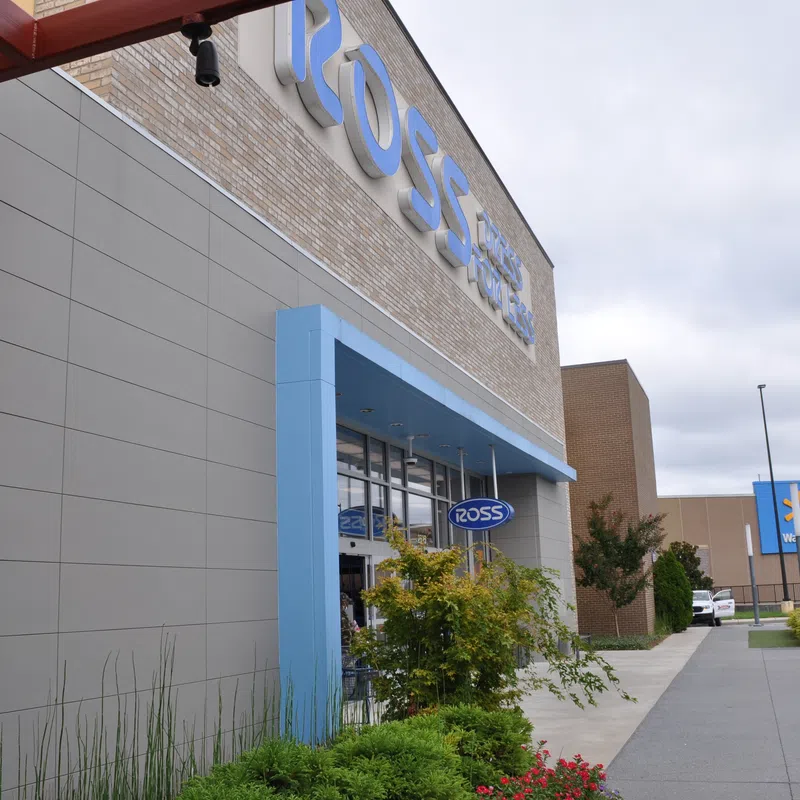 Exterior view of a Ross Dress for Less store with Walmart in the background on a cloudy day