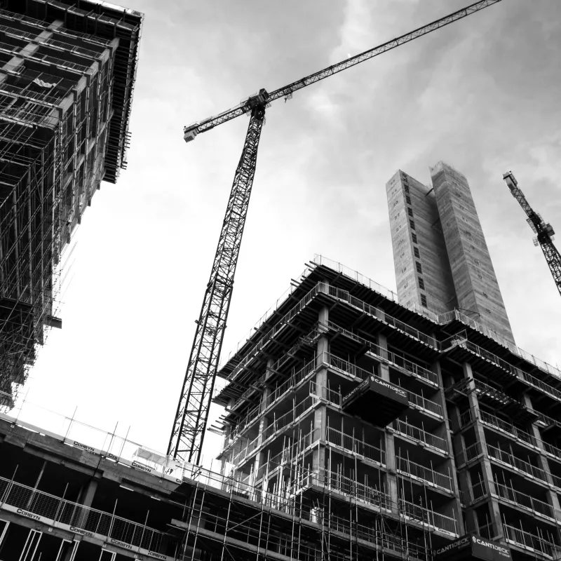 a crane next to a building