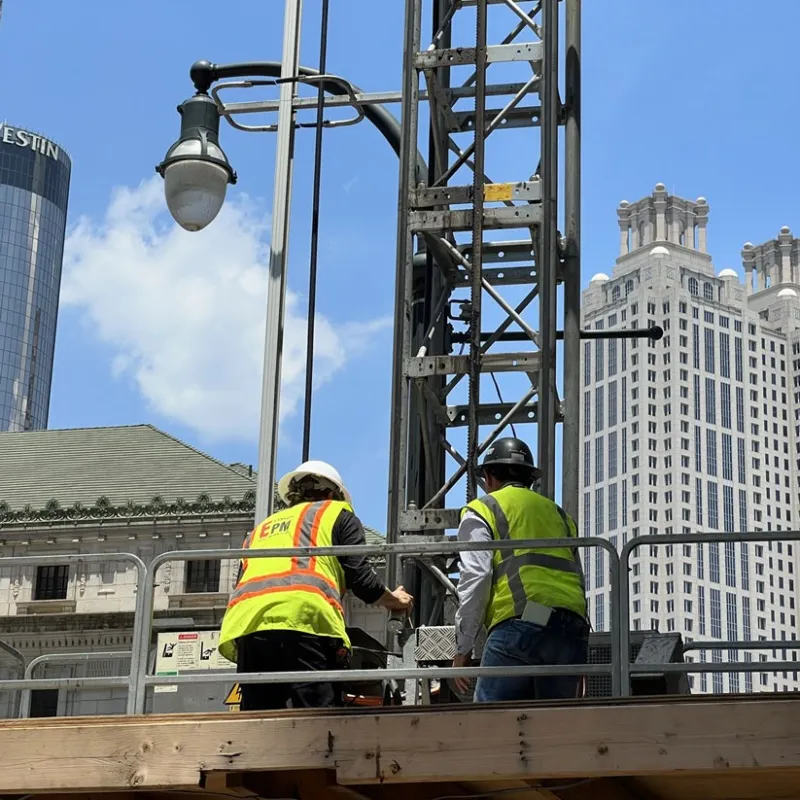 a few men in hardhats on a construction site