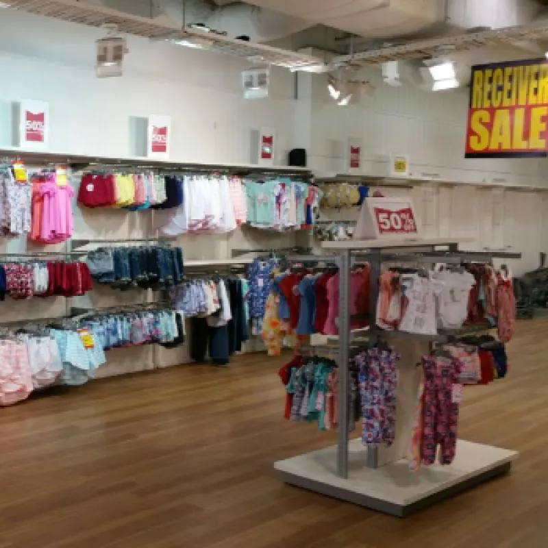 a store with a lot of clothes on the wall