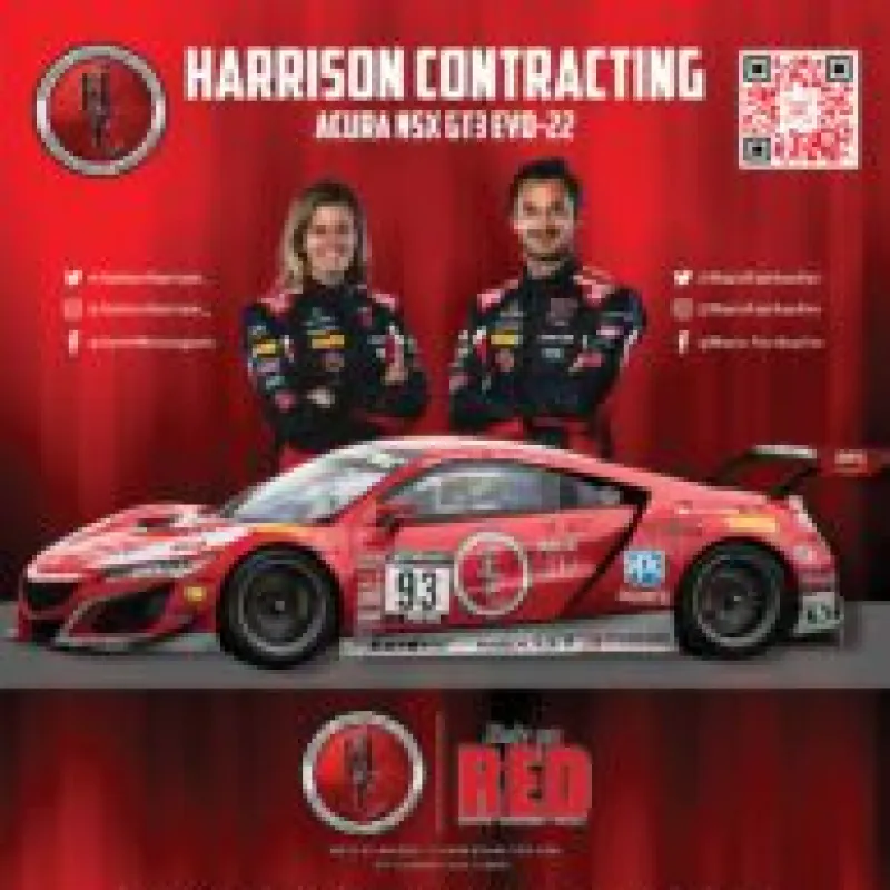 Red racing car with number 93 and two drivers in black racing suits standing against a red Harrison Contracting backdrop.