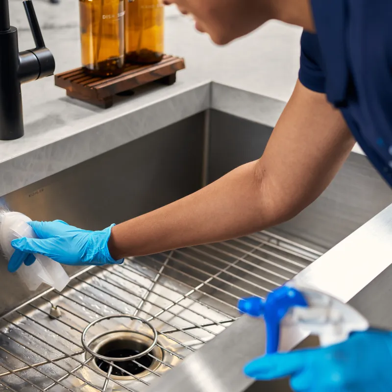 MaidPro house cleaning services cleaning the sink of a home in Maryland