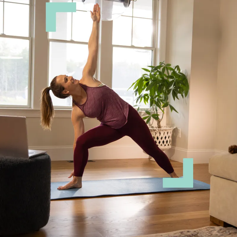 a woman doing yoga in a room