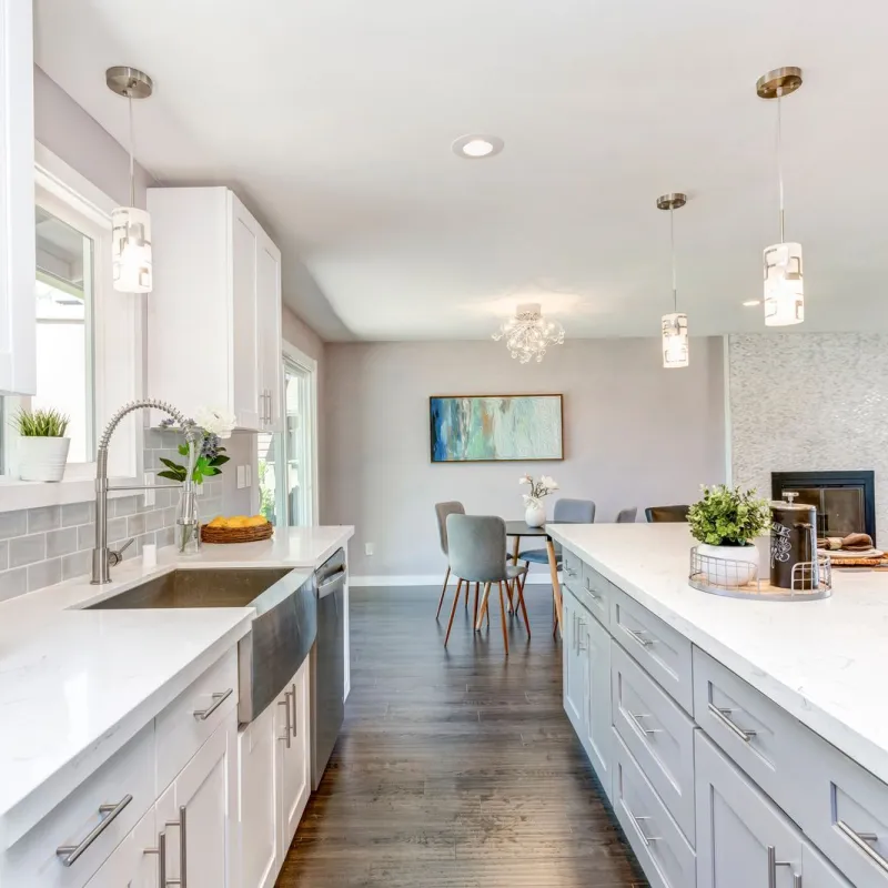 a kitchen with white cabinets