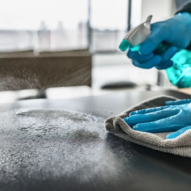 a man cleaning a counter