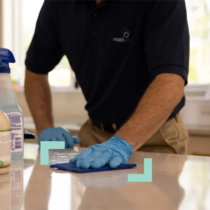 a man cleaning a counter
