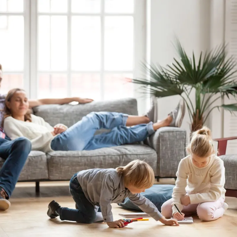 a family sitting on the floor