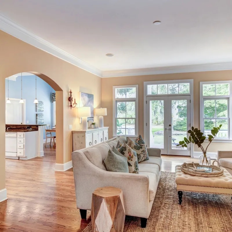 a living room with a large mirror