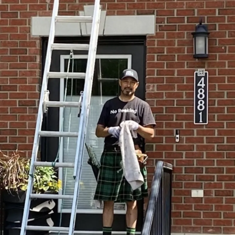 A man on a porch with a ladder