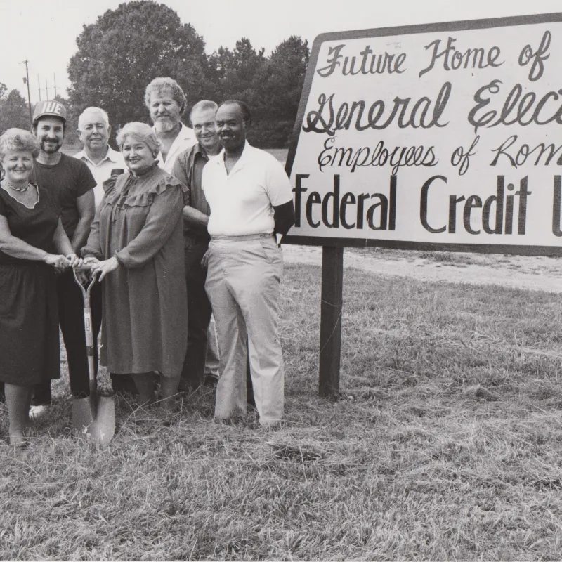 Group of General Electric employees at groundbreaking event for Rome Federal Credit Union future site.