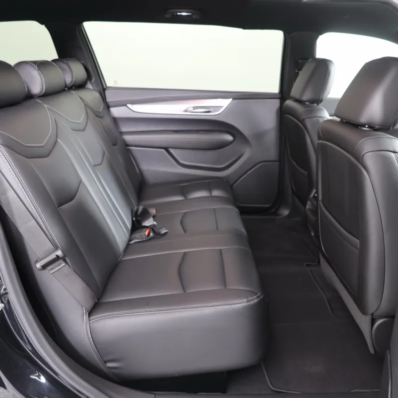 Interior view of a spacious SUV with black leather seating and a modern design.