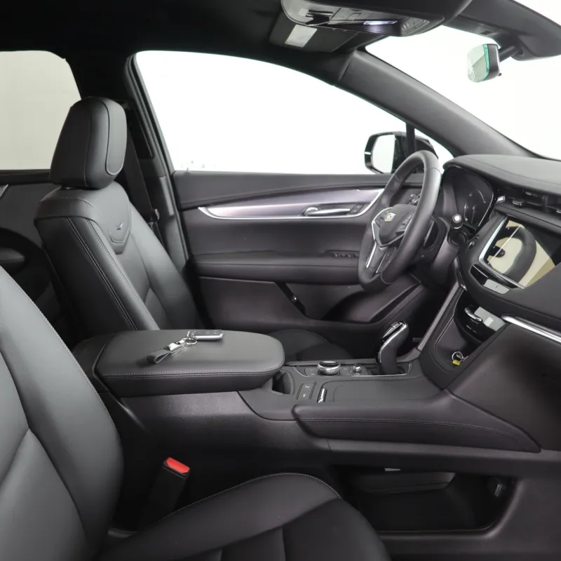 Interior view of a modern car showcasing sleek black leather seats and a stylish dashboard design.