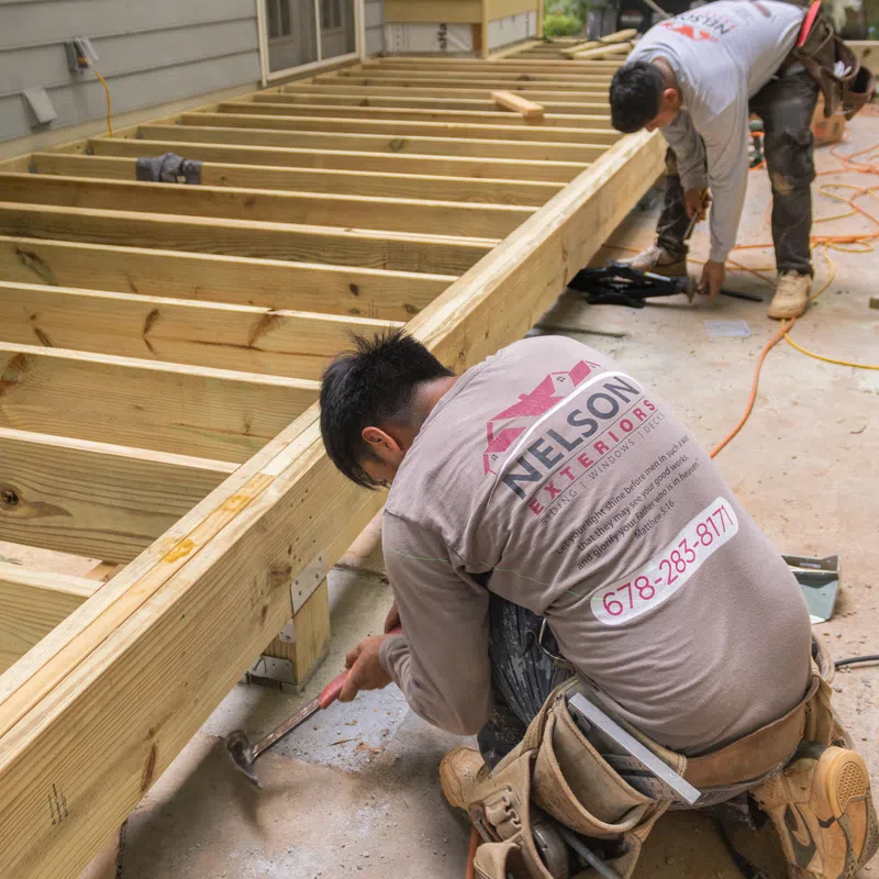 Atlanta deck builders installing deck framing in Marietta by Nelson Exteriors