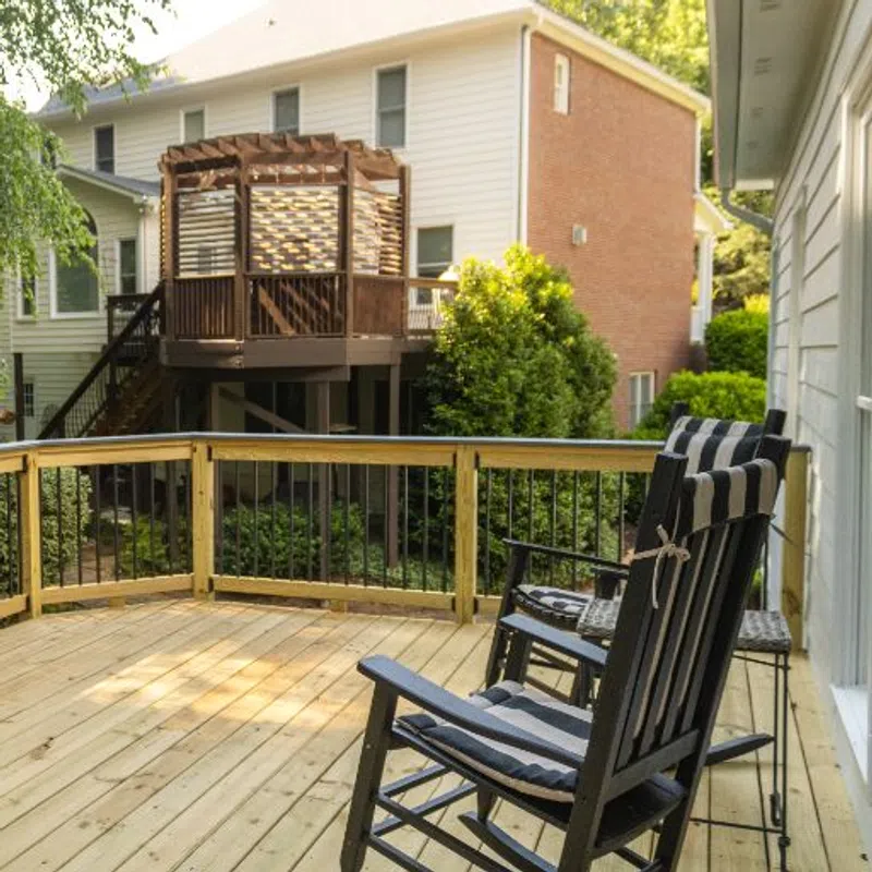 Outdoor deck with rocking chairs how to tell if deck boards need replaced service in Marietta GA by Nelson Exteriors