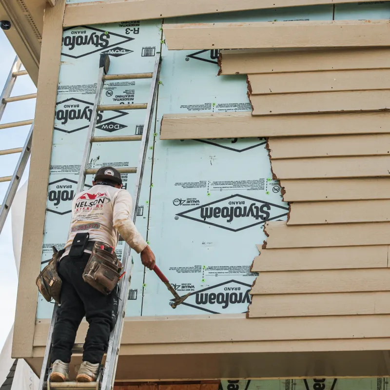 a person painting a building