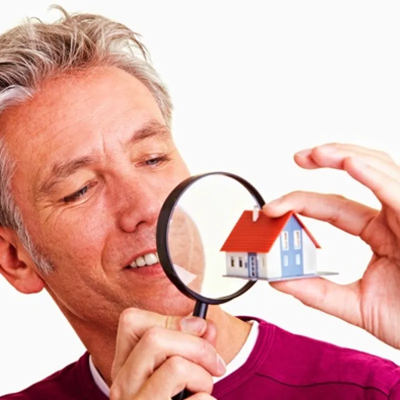 a man holding a pair of glasses