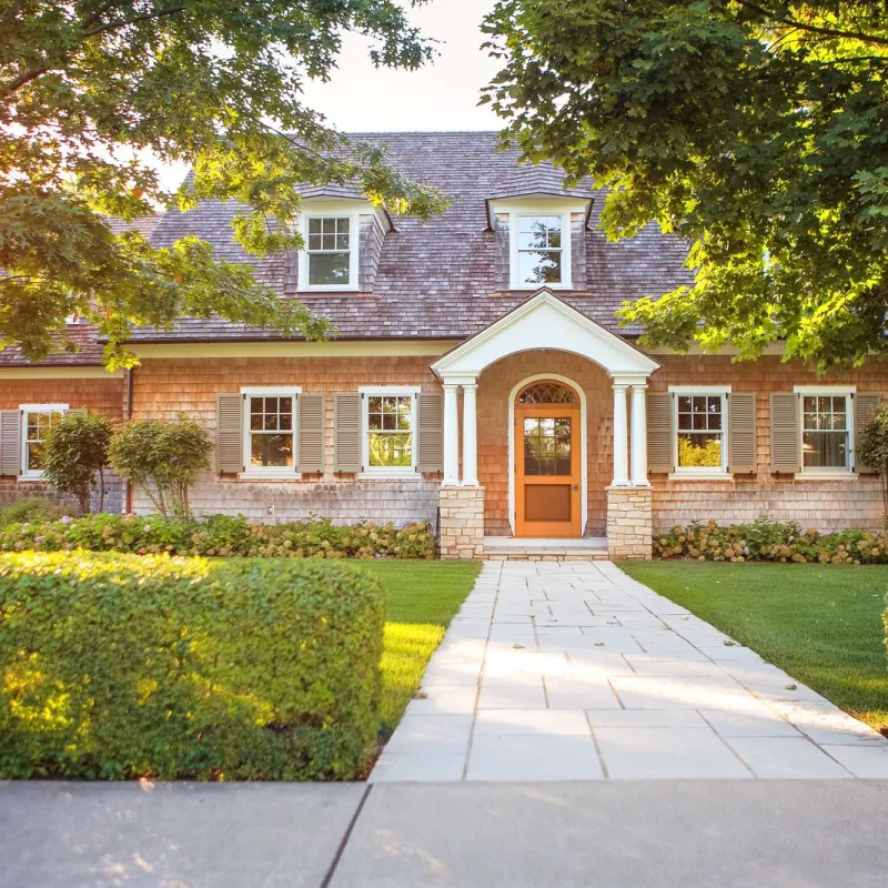 a brick house with a front yard
