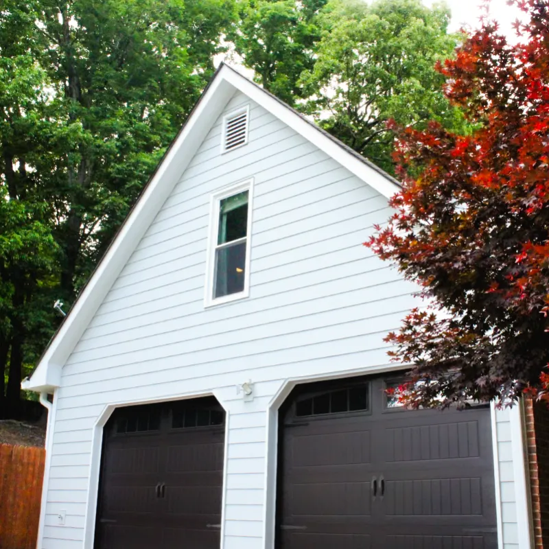 a white house with a garage