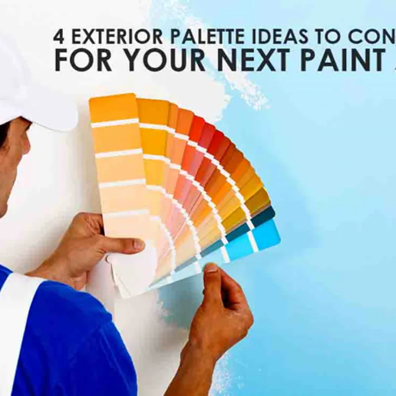 a man holding a large stack of boxes