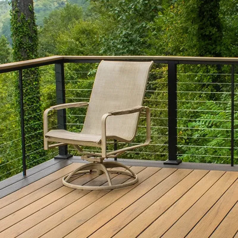 Custom-built two-tier multi-level deck overlooking a wooded Marietta backyard by Nelson Exteriors